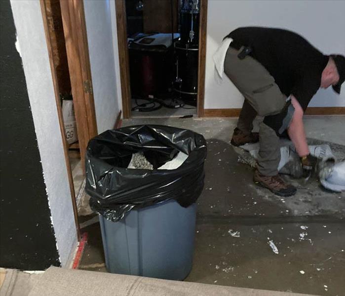 A SERVPRO team cleaning up water damage